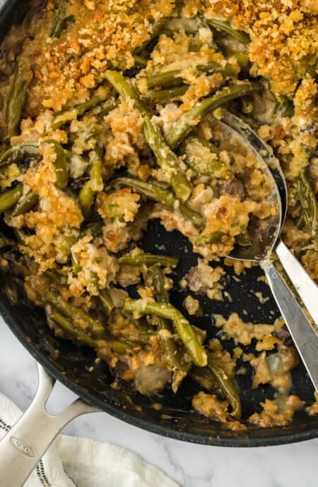 The best green bean casserole recipe with spoons digging in