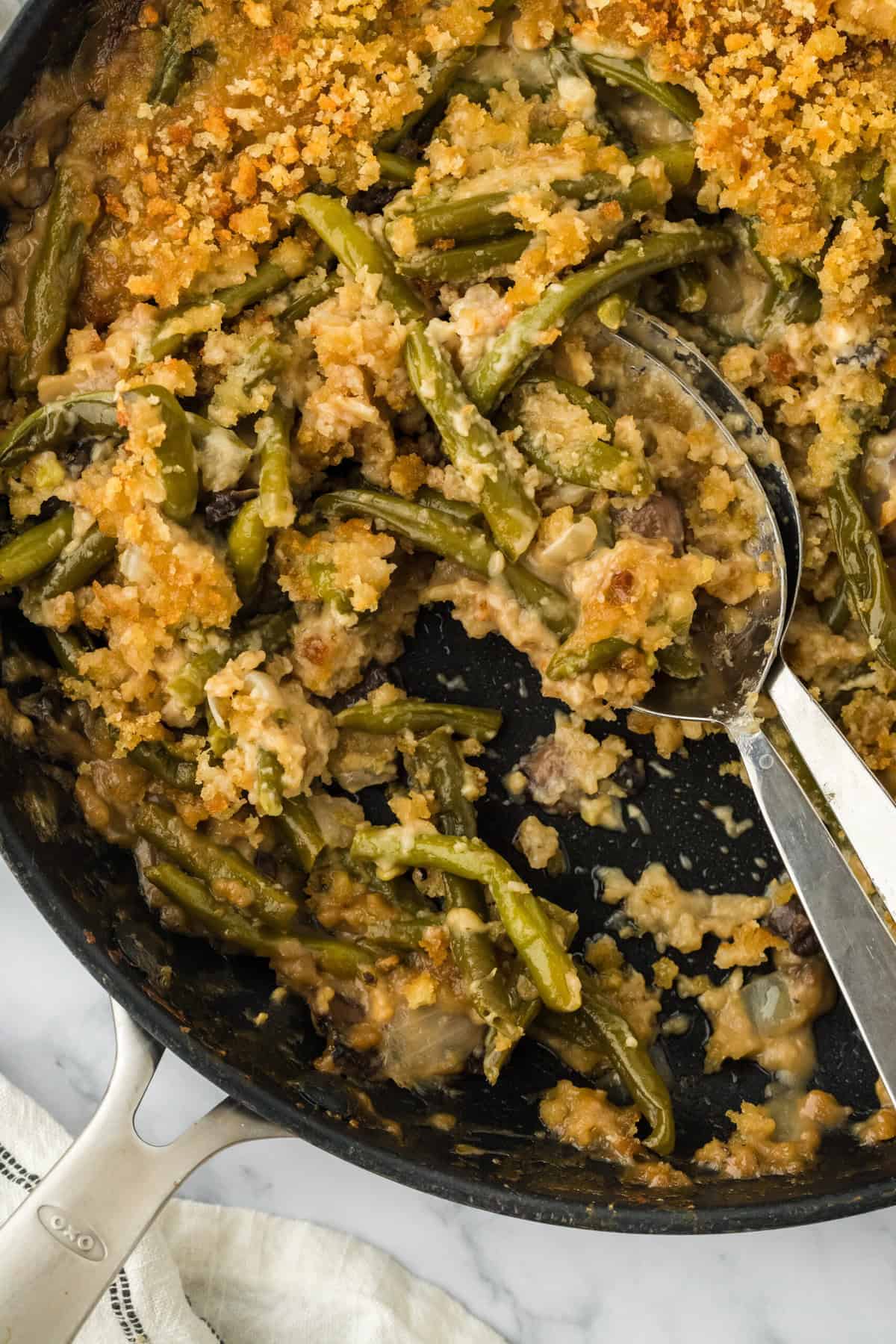 The best green bean casserole recipe with spoons digging in