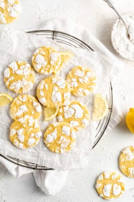 Lemon crinkle cookies on a white wrinkled parchment paper ready to serve