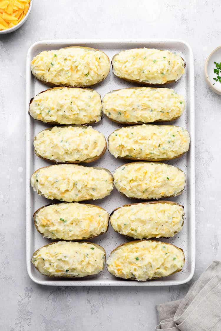 Potato filling added into potato shells before baking