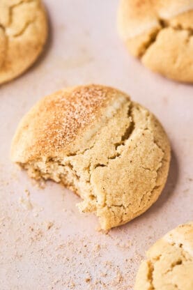 A close up of a chai butter cookie with a bite missing