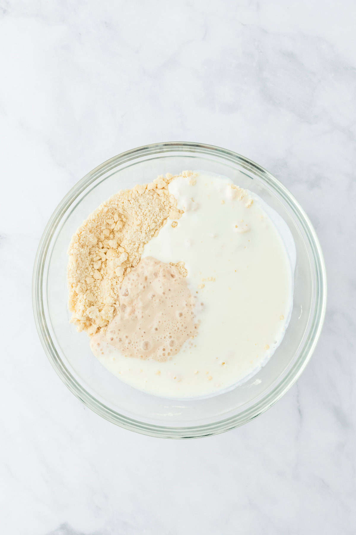 Yeast mixture plus buttermilk poured into biscuit dough