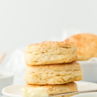 A stack of angel biscuits on a white plate