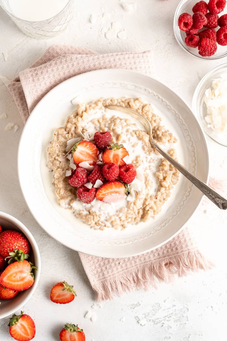 A close up of a homemade rice pudding with a spoon ready to enjoy