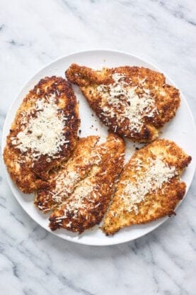 Breaded and fried chicken cutlets with parmesan on top