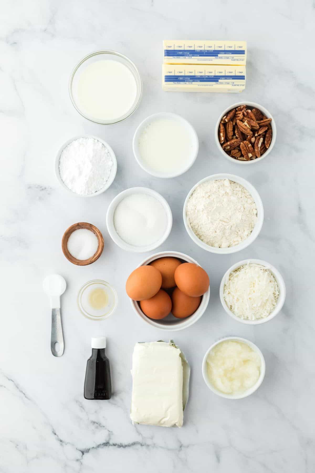 Overhead shot of ingredients for making  Italian cream cake on a marble surface before mixing