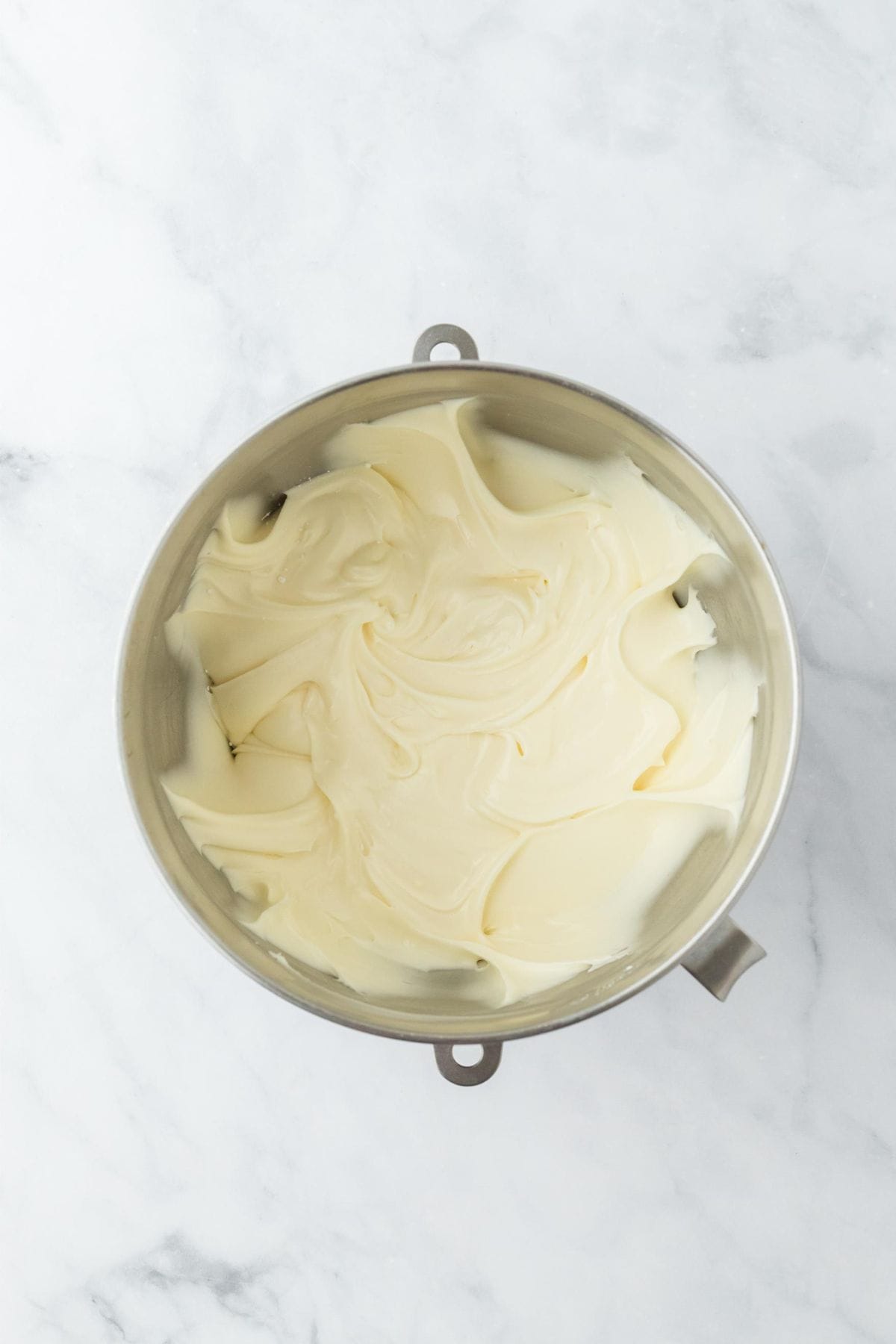 Smooth, creamy cream cheese frosting in the bowl