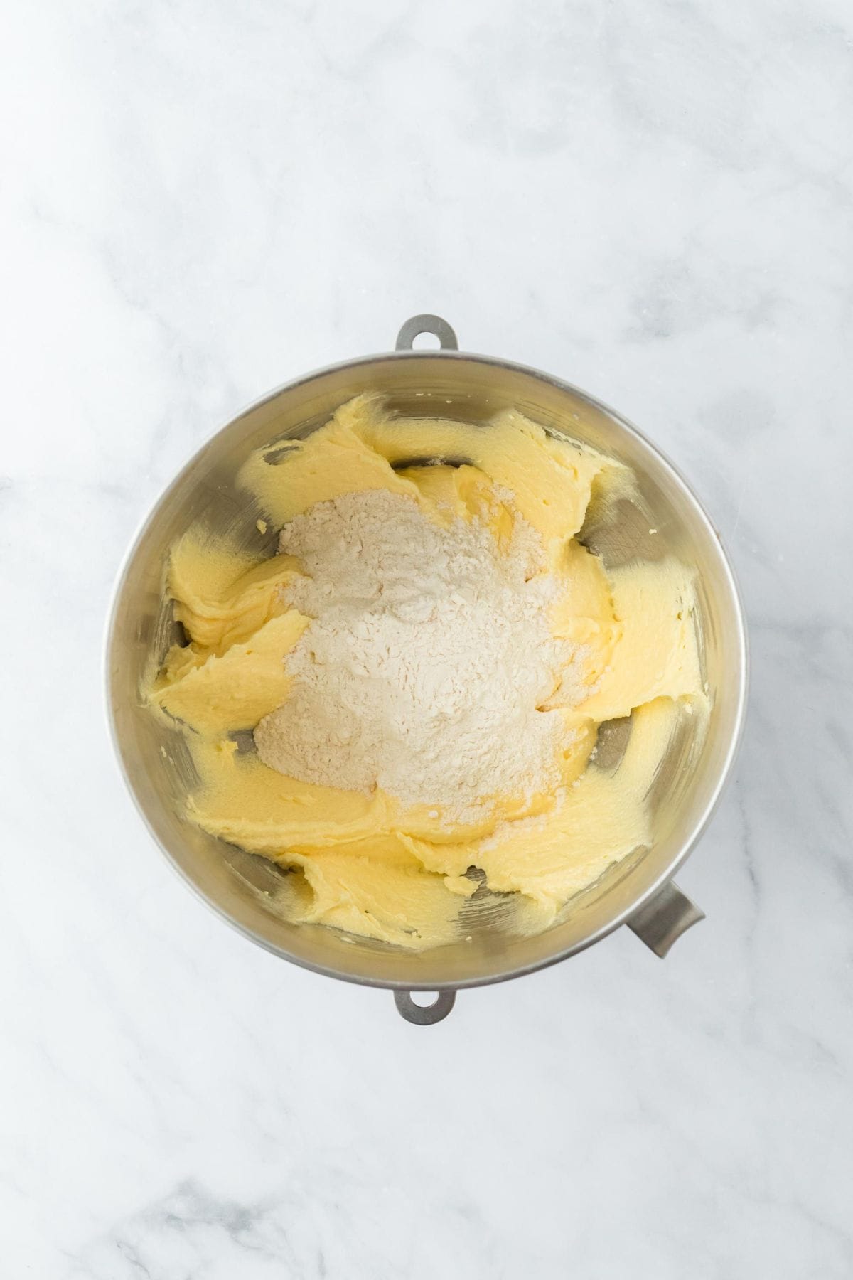 The mixing bowl with dry ingredients added to the creamed butter and sugar mixture