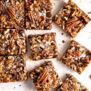 Cut pecan pie bars against a white background ready to serve