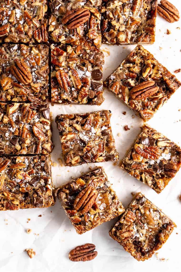 Cut pecan pie bars against a white background ready to serve