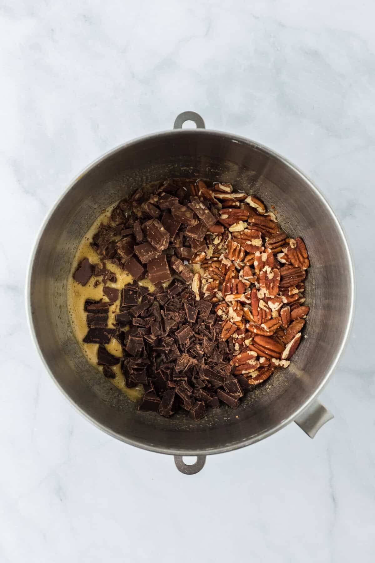 Pecans added to pecan pie bar filling mixture