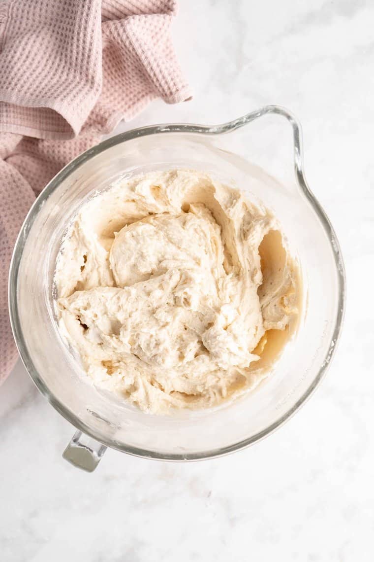 A white cake recipe batter after being mixed in a mixing bowl before baking.