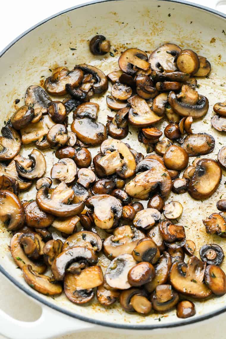 Mushrooms in a large skillet after being sauteed