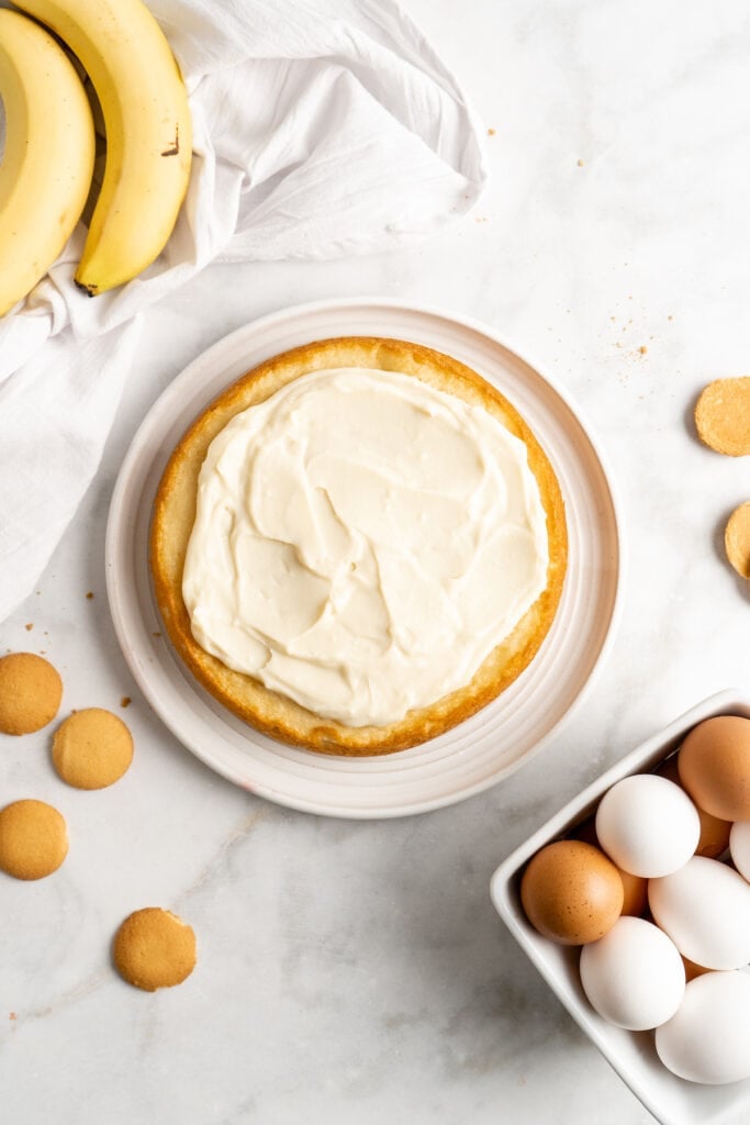 A layer of cake with banana pudding spread on top