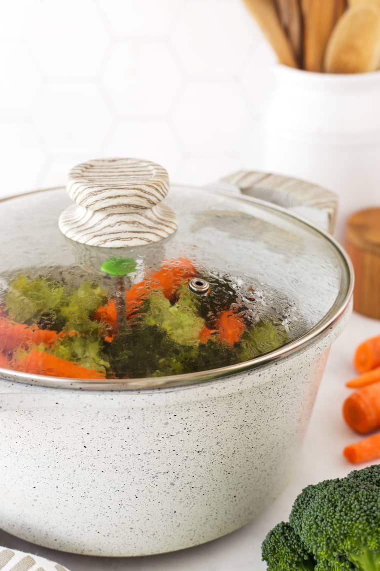 A tutorial on how to steam vegetables with some in a container with the lid on