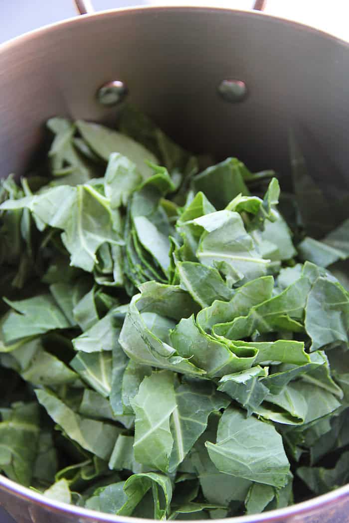 Mustard greens cut in a large pot