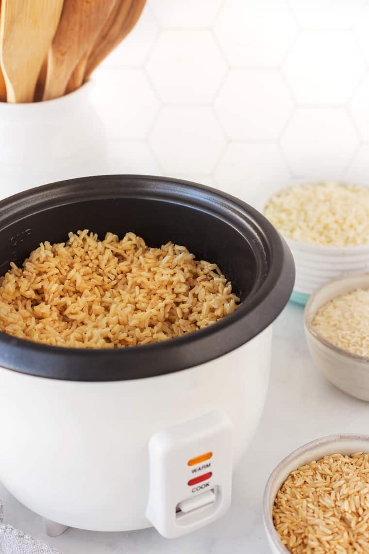 A rice cooker filled with fluffy brown rice