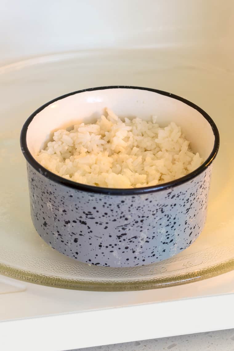 A small bowl with white rice in a microwave 