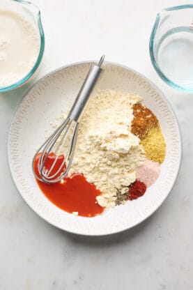 White flour with seasonings separated before whisking together