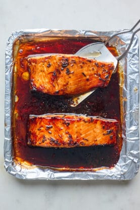Air fryer salmon in a foil lined tray being served