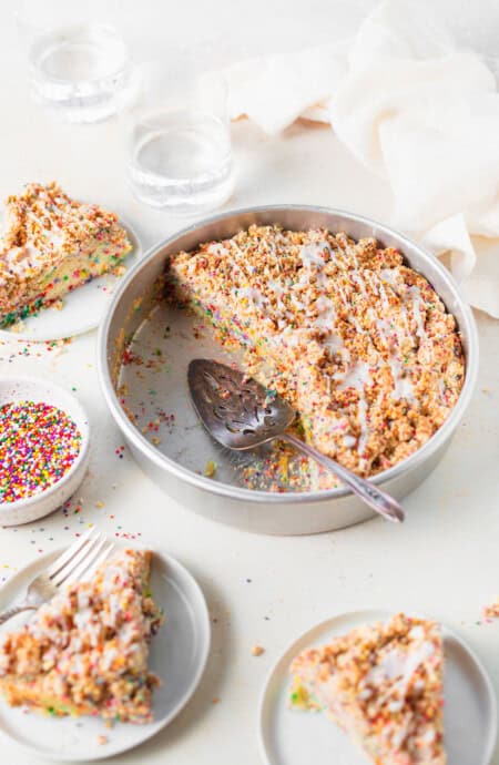 A delicious funfetti cake with slices removed ready to serve