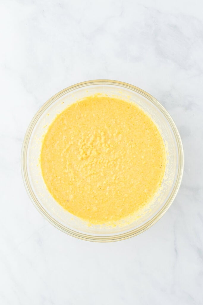 A smooth corn pone mixture in a clear bowl