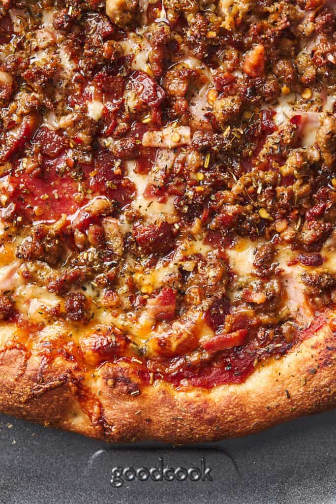 A close up of meat pizza ready to enjoy