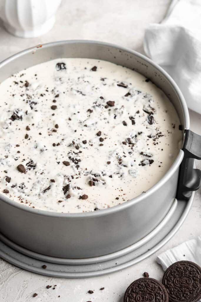 Oreo cheesecake filling inside a springform pan
