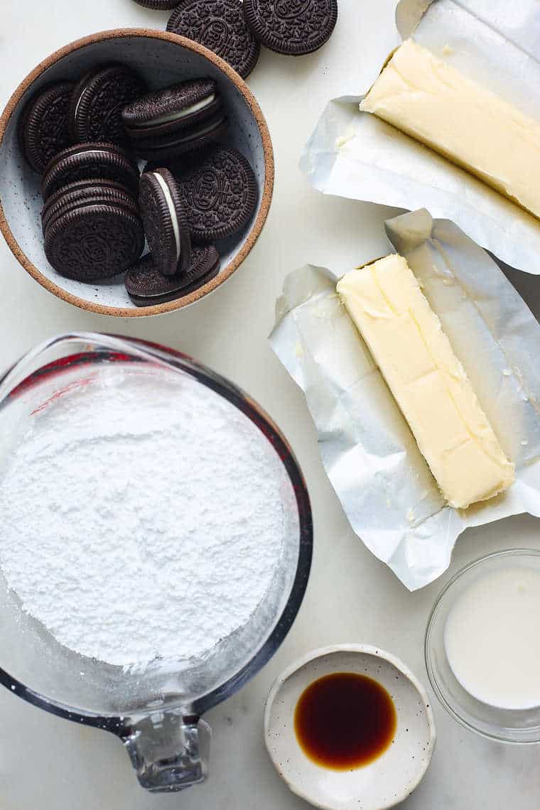 Ingredients of oreos, powdered sugar and butter before mixing into a buttercream