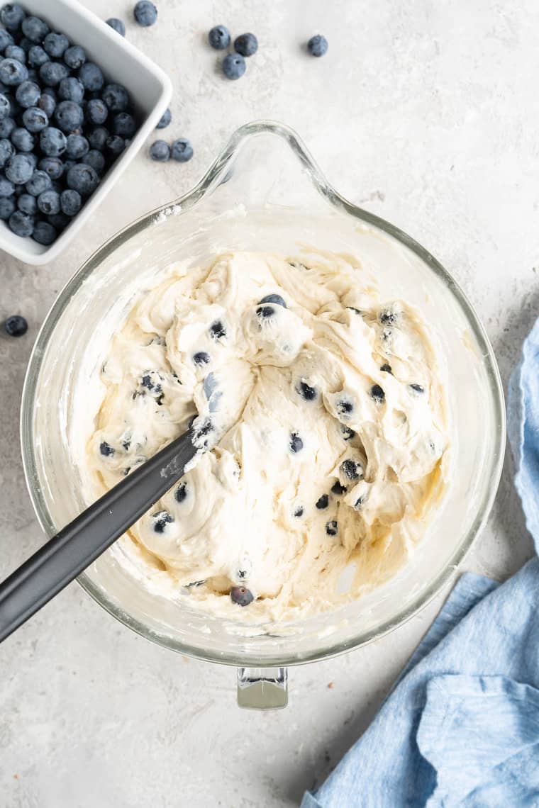 Blueberries folded into a cake batter