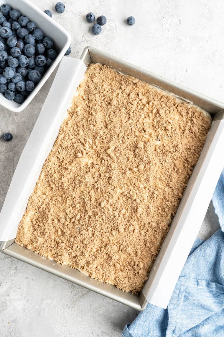 Crumble topping sprinkled on top of a coffee cake before baking