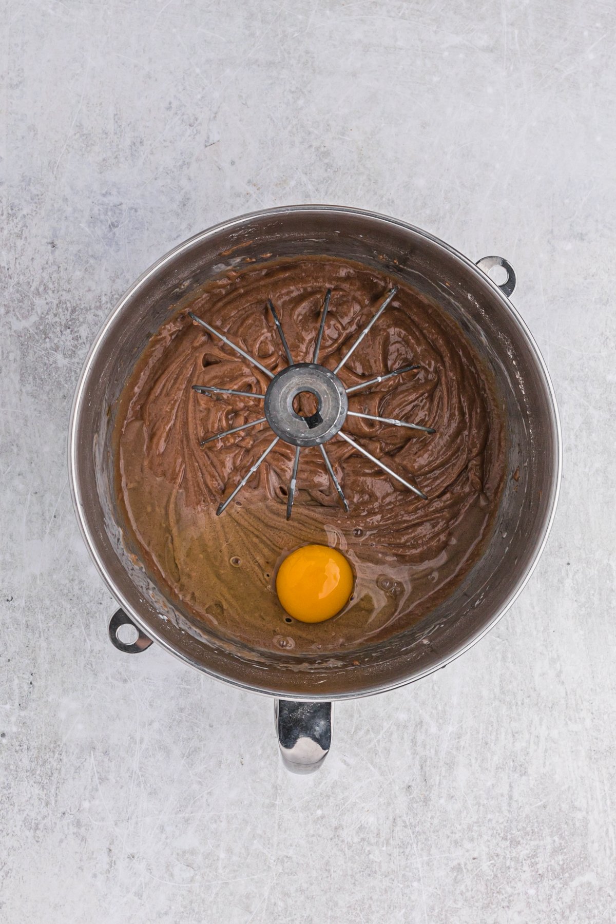 Chocolate cake batter with eggs before mixing in a stand mixer