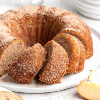 A close up of apple cider donut cake ready to serve