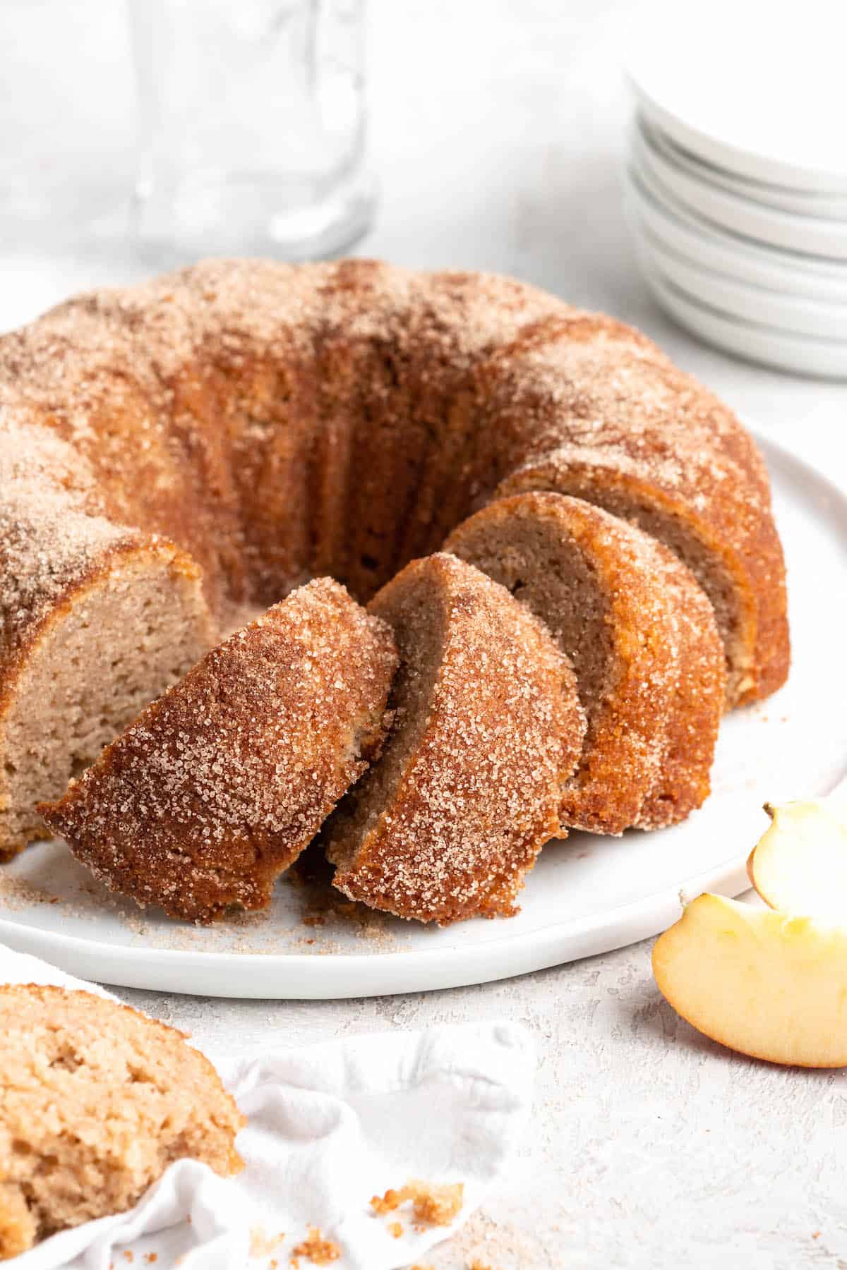 A close up of apple cider donut cake ready to serve