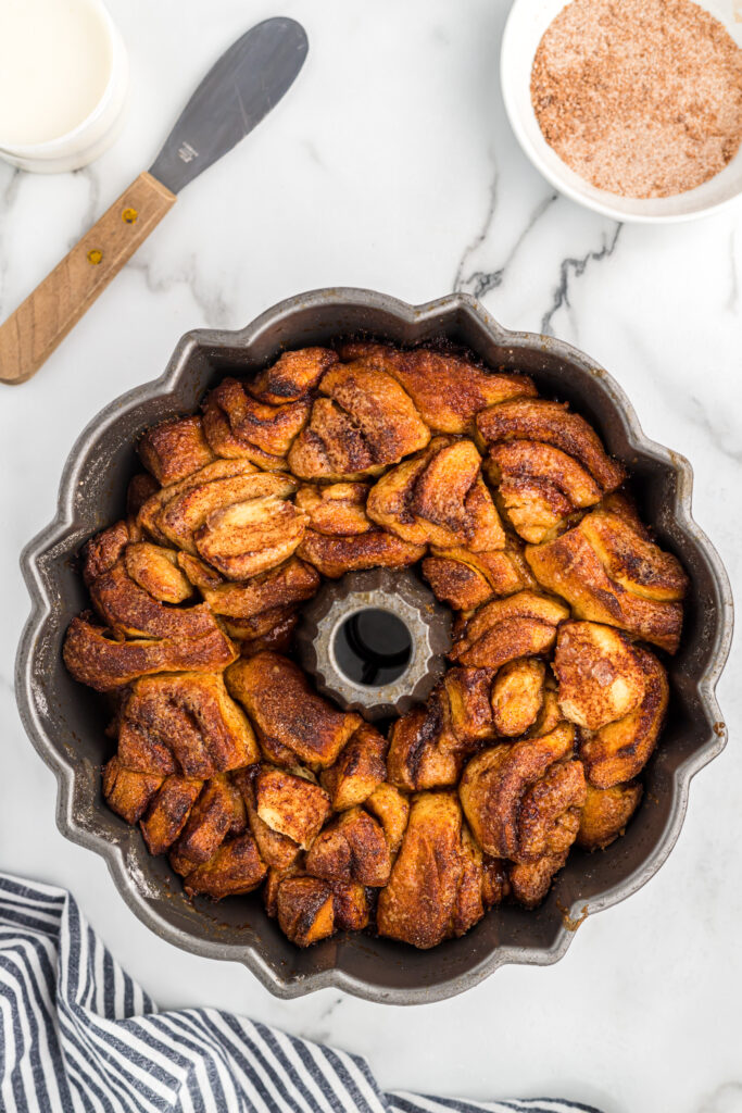 Baked cinnamon roll pieces in a bundt pan