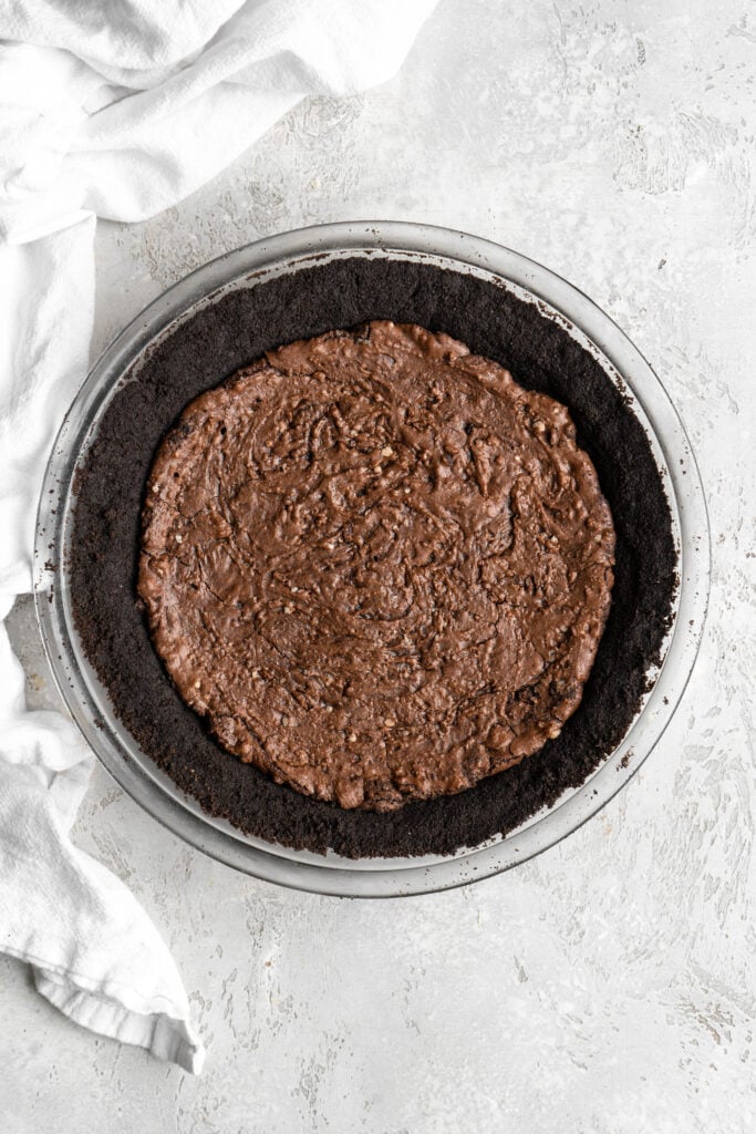 A cookie crust with a brownie layer baked inside