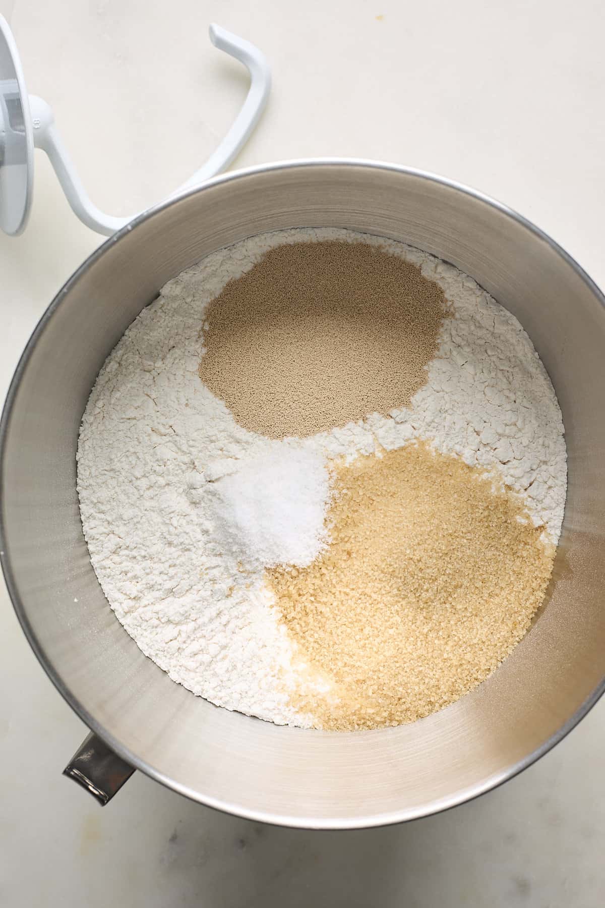 Flour, yeast and other dry ingredients in a mixing bowl