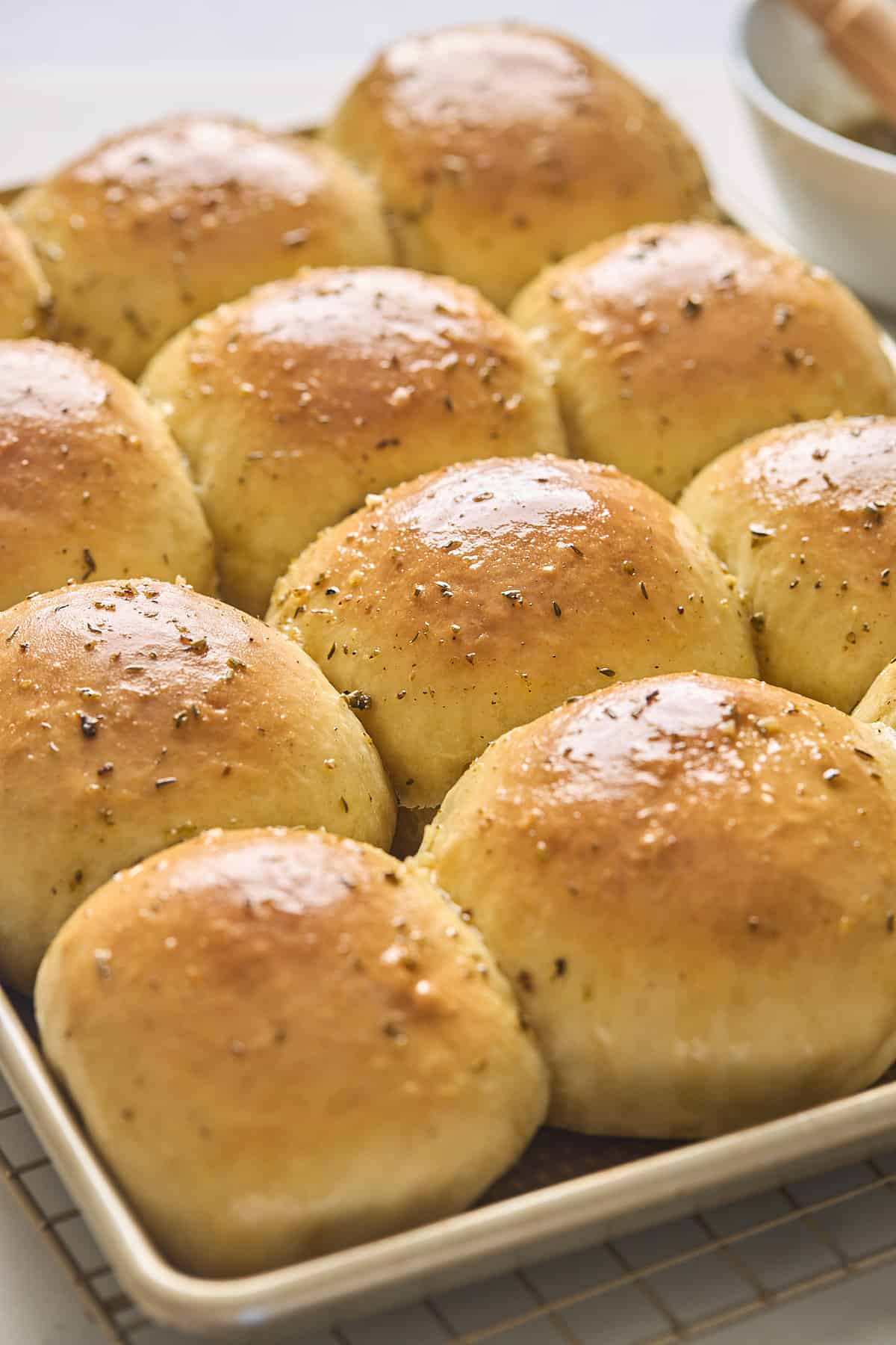 Just baked potato rolls out of the oven on a baking sheet