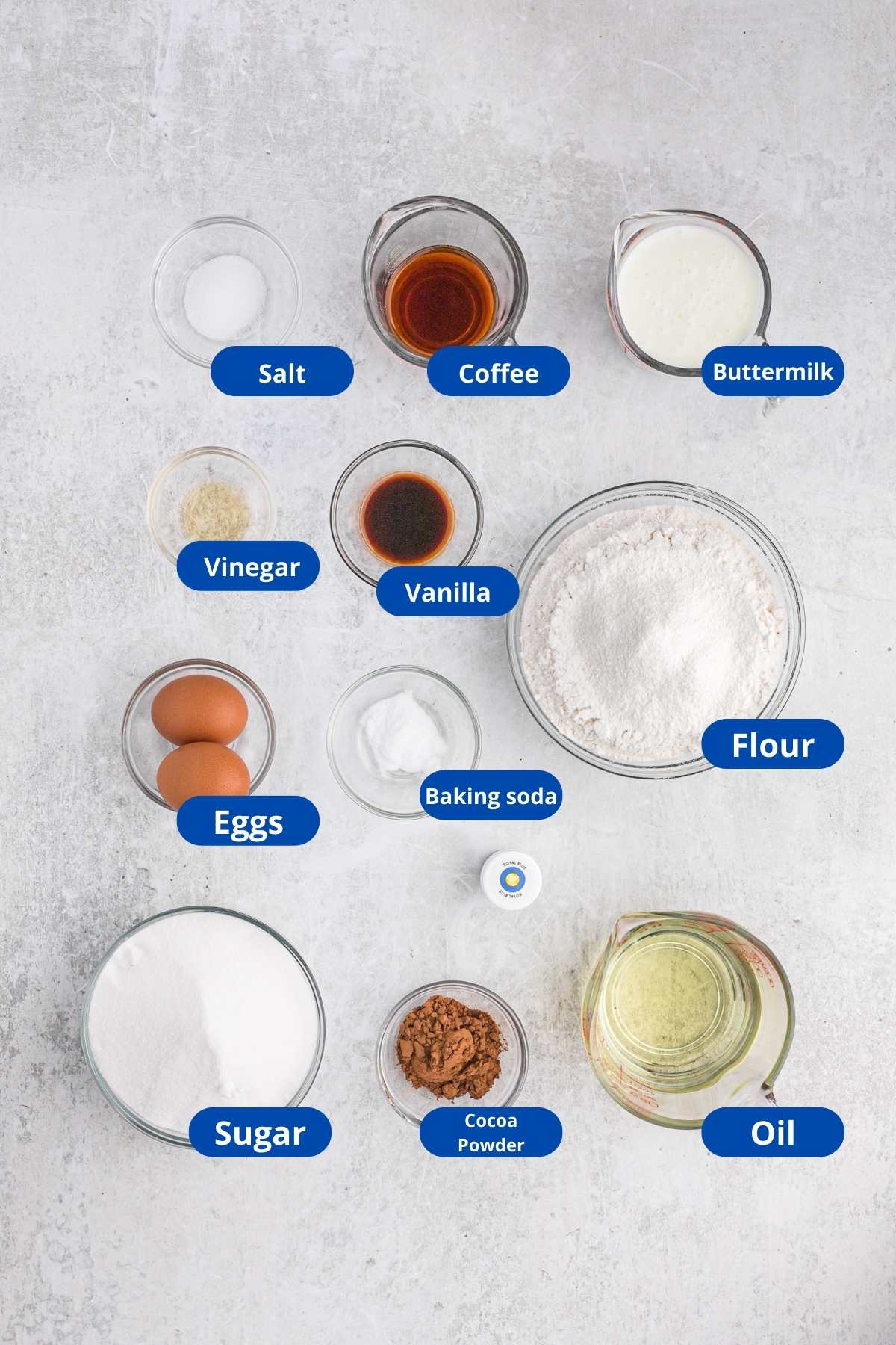 Ingredients for a cake batter in separate clear bowls