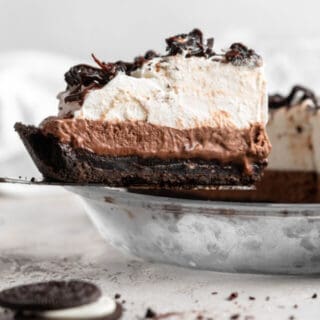 A slice of Mississippi mud pie being lifted from the pie to serve