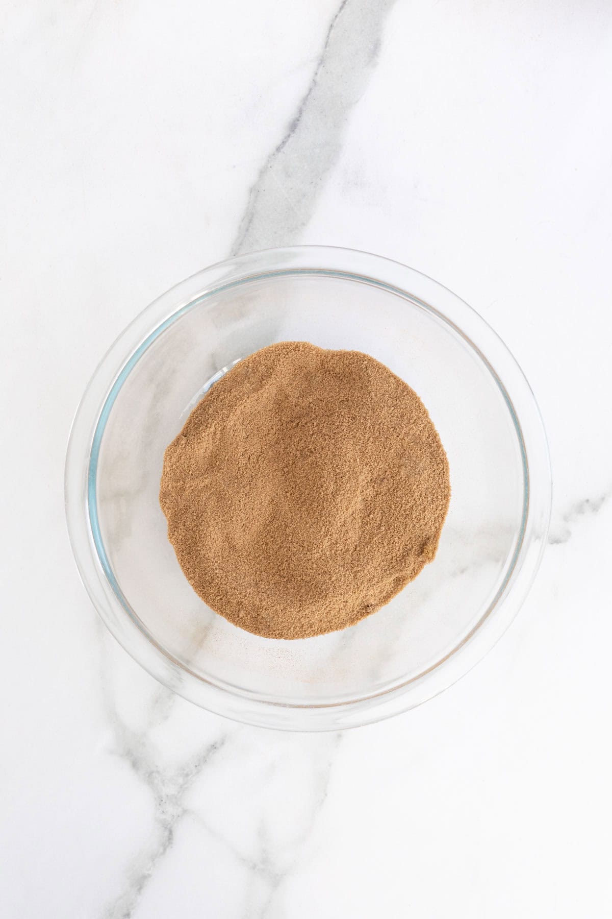 Brown sugar and cinnamon fully combined in a glass bowl