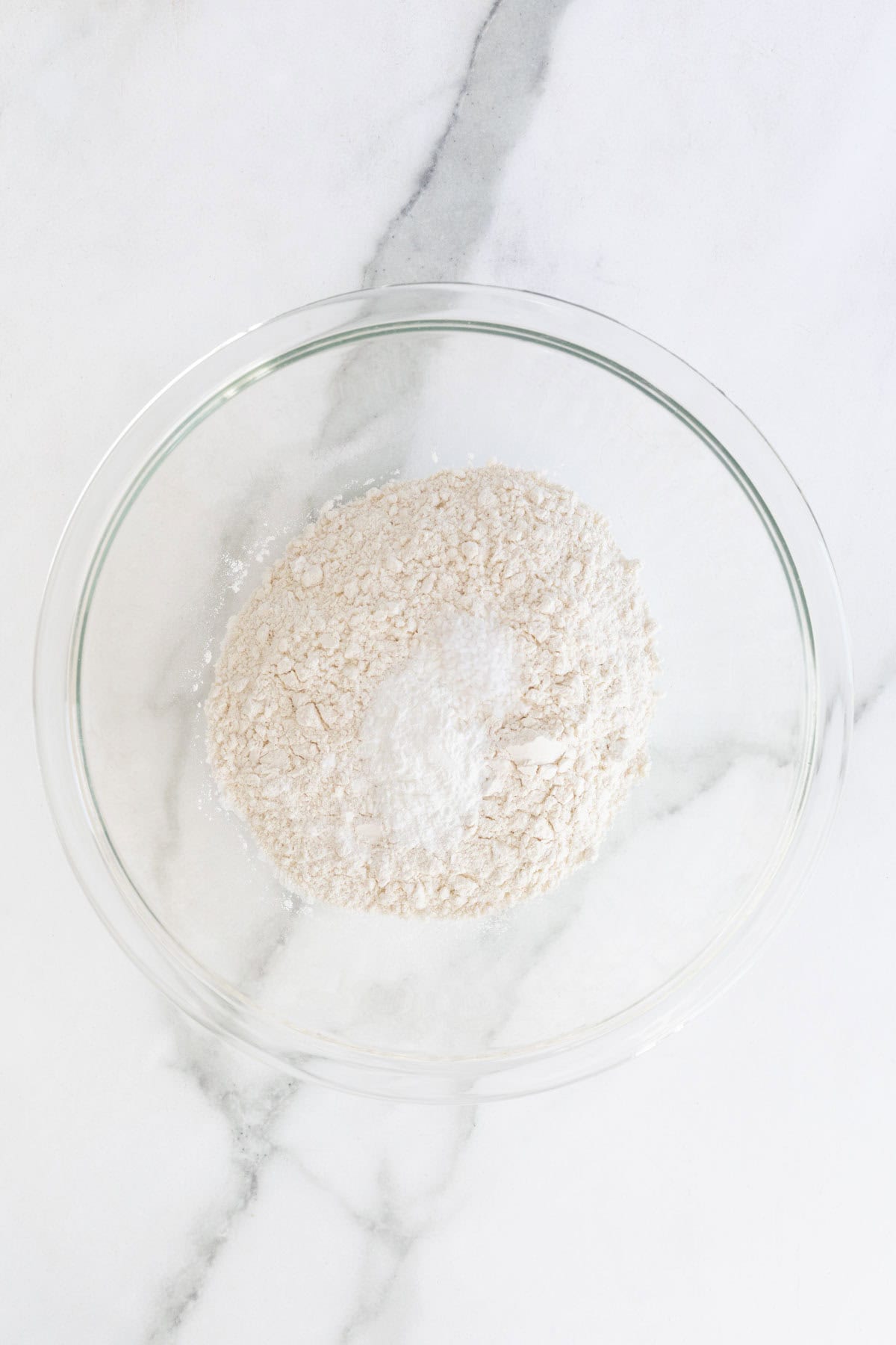 Glass bowl with flour and leavening agents
