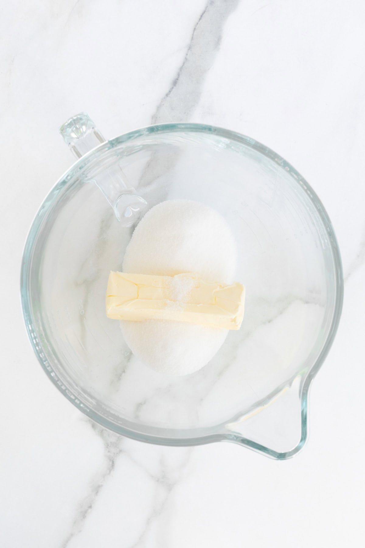 Butter and sugar in glass bowl