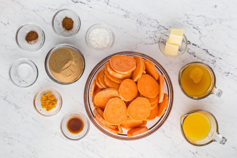 Ingredients to make candy yams recipe in small bowls on a white surface.