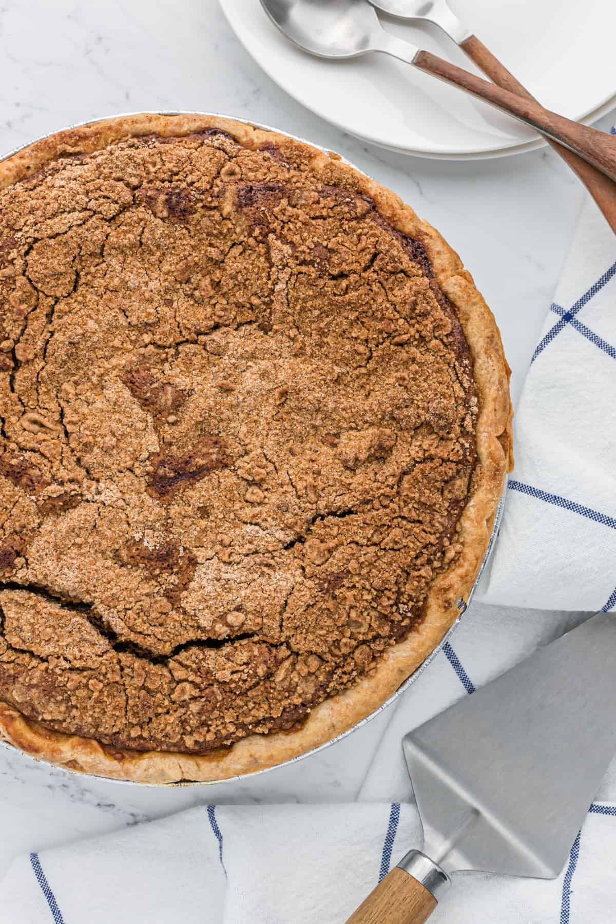 Fully baked shoofly pie recipe on a white counter.