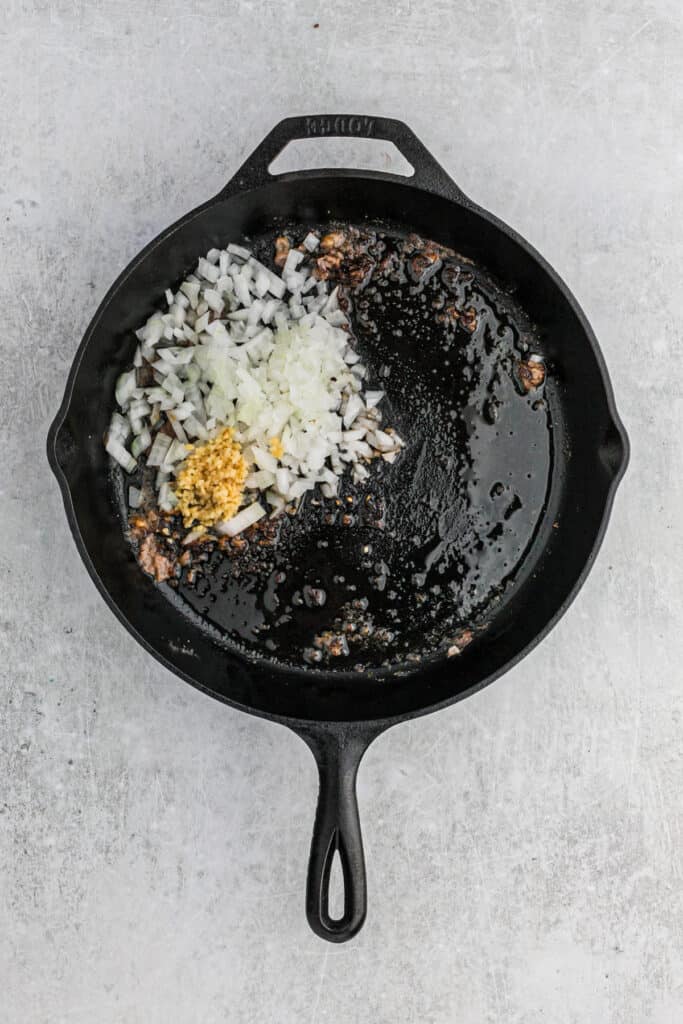Raw onions diced and placed in a cast iron skillet of beef fat.