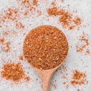 A small wooden spoon filled with homemade turkey rub.