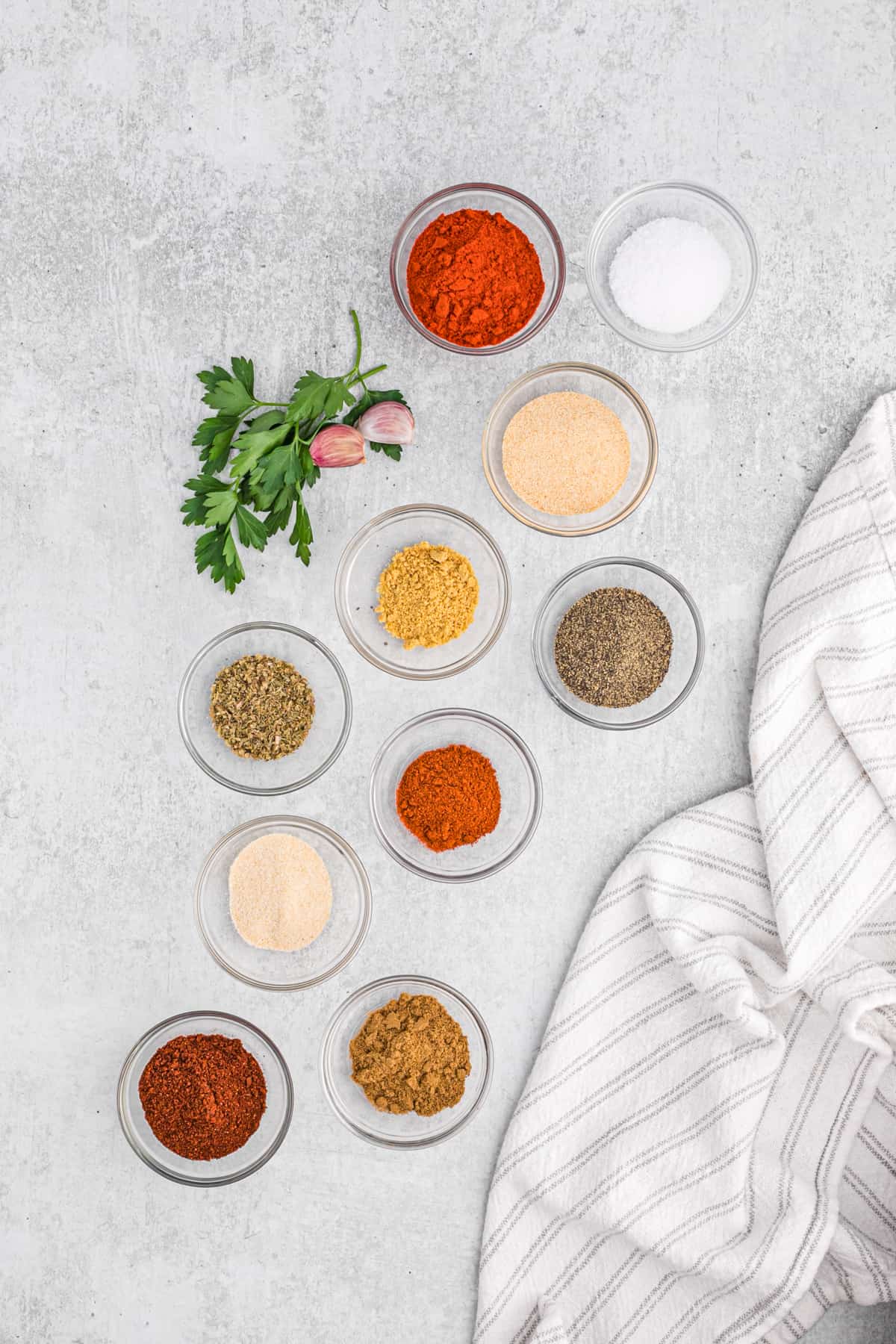 Small bowls filled with individual spices to make homemade turkey rub.