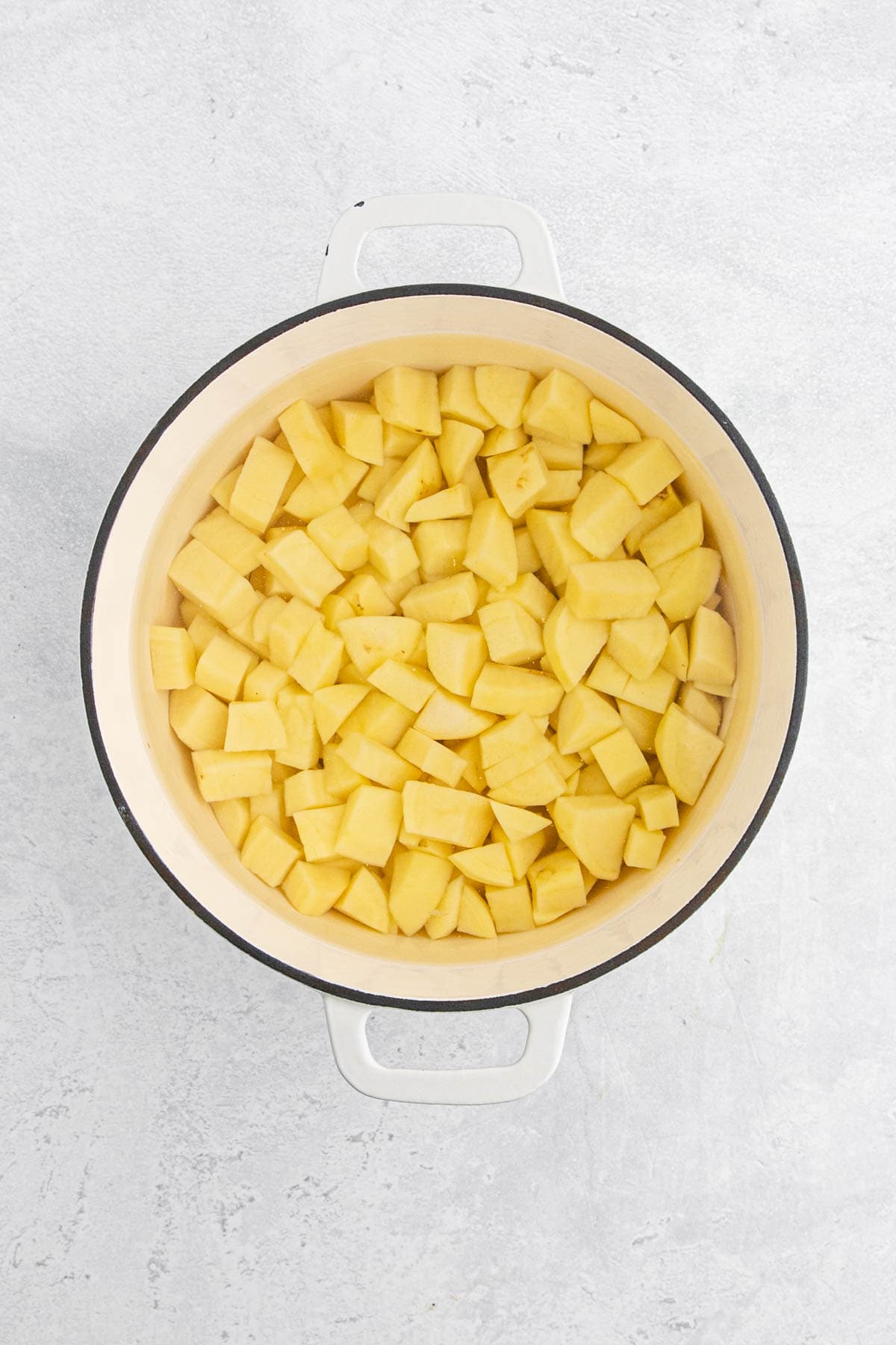 Water and diced yukon gold potatoes in a large pot with water ready to boil