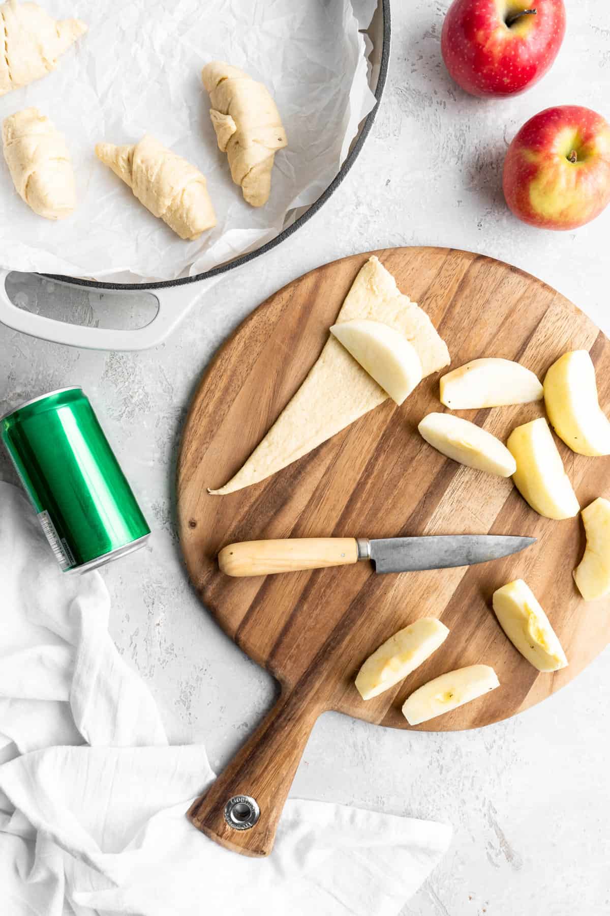apple slices and crescent triangles on a cutting board 